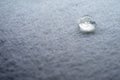 water drop on top of white fabric sheet Royalty Free Stock Photo