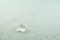 water drop on top of white fabric sheet Royalty Free Stock Photo
