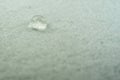 water drop on top of white fabric sheet Royalty Free Stock Photo