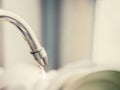 Water drop , water leaking from tap after clean dish , think for Royalty Free Stock Photo