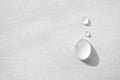 Water drop on white paper textured background with copy space and selective focus, close-up. Concept moisturizing macro Royalty Free Stock Photo