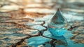 Water Droplet on Dry Cracked Earth. Drought, climate change, fresh water shortage concept Royalty Free Stock Photo