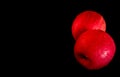 Water droplet on glossy surface of red apple on black background Royalty Free Stock Photo