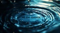 A water droplet with the words "be the change" written below it Royalty Free Stock Photo