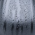 Water droplets cover a smooth glass surface creating a pattern Royalty Free Stock Photo