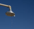 water droplets dripping from the shower head in the beach shower Royalty Free Stock Photo