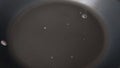 Water droplets evaporate in the pan. Heated surface