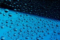 Water droplets on glass on blue stainless steel background  Background  Wallpaper  Patter. Royalty Free Stock Photo