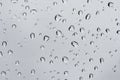 Water droplets on the glass in the rain. Water rain drop on window glasses Royalty Free Stock Photo