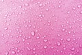 Water droplets on pink fiber waterproof fabric.