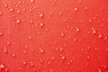 Water droplets on red color textile Royalty Free Stock Photo