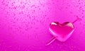 Water droplets in the shape of heart with Arrow embroidered in the meaning of love. A lot of droplets On metallic surfaces in pink Royalty Free Stock Photo