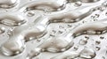 Water droplets on a silver, reflective, undulating surface.