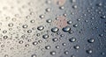 Water droplets uniformly spread across a smooth surface, with reflections creating a Royalty Free Stock Photo