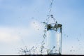 Water dropping into the glass. Royalty Free Stock Photo