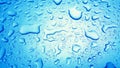 Water Drops background on the Blue glossy surface, Rain droplets Royalty Free Stock Photo