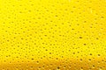 Water drops background. Rain texture on Yellow window glass. Wet pattern. Royalty Free Stock Photo