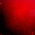 Water Drops background on the red glossy surface, Rain droplets on red texture Royalty Free Stock Photo
