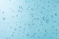 Water drops background. Water drops on glass window over blue sk Royalty Free Stock Photo