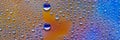 Water drops banner. Droplet texture. Abstract gradient backdrop Multicolored blue-gold rainbow gradient. Heavily textured image.