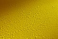 Water drops beading on a yellow metal surface Royalty Free Stock Photo