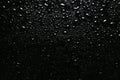 Water drops on black glass surface, top view Royalty Free Stock Photo