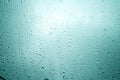 Water drops on blue background / Drops of rain on glass , rain drops on clear window / Blue Abstract Water Drops Background / Royalty Free Stock Photo