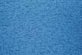 Water drops on blue color metal surface with blur effect in navy Royalty Free Stock Photo