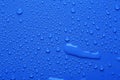 Water drops on blue color  surface Royalty Free Stock Photo