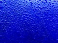 Water drops on blue plastic surface background Royalty Free Stock Photo