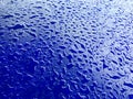 Water drops on blue plastic surface background Royalty Free Stock Photo