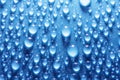 Water drops blue surface Royalty Free Stock Photo