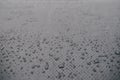 Water drops on car carbon. Dark wallpaper