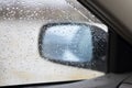 water drops on a car side glass and window in rain Royalty Free Stock Photo