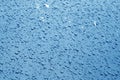 Water drops on car surface in navy blue tone Royalty Free Stock Photo