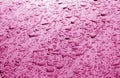 Water drops on car surface in pink tone Royalty Free Stock Photo