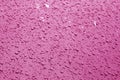 Water drops on car surface in pink tone Royalty Free Stock Photo