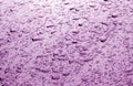 Water drops on car surface in purple tone Royalty Free Stock Photo