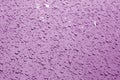Water drops on car surface in purple tone Royalty Free Stock Photo