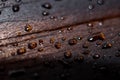 Water drops on a dark wooden background Royalty Free Stock Photo