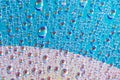 Water drops on dvd media, water drops on colorful background Royalty Free Stock Photo