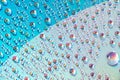 Water drops on dvd media, water drops on colorful background Royalty Free Stock Photo