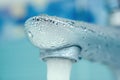 Water drops on the faucet in the bathroom. Macro photo Royalty Free Stock Photo