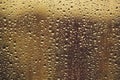 Water drops flow down on the glass in the rain Royalty Free Stock Photo