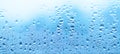 Water drops on glass. Blue abstract wall background Royalty Free Stock Photo