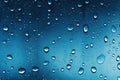 Water drops on glass with blue background. Rain drops on window