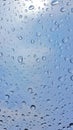 Water drops on glass blue sky Royalty Free Stock Photo