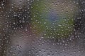 Water drops on the glass of a public transport stop in bad cloudy rainy weather Royalty Free Stock Photo