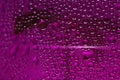 Water drops on glass. Purple beautiful abstract background. Macro Royalty Free Stock Photo