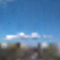 Water drops on glass after rain. Raindrop on the window vector. Droplet on blue sky background with clouds.